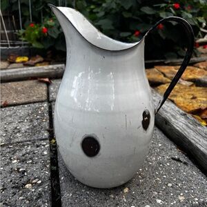 Antique Enamel Metal Pitcher W/Black Handle
Vintage 1940's (approx) measures 12"